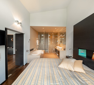 View of the bedroom and bathroom in the Roof Spa Suite