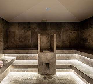 Modern sauna with stone benches