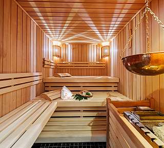 Wooden sauna with infusion basin