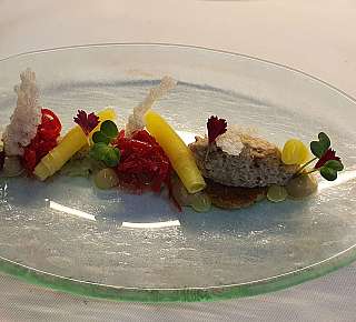 Fine gourmet dish on glass plate