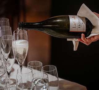 Sparkling wine is being poured