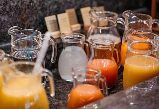Glass carafes with fruit juices