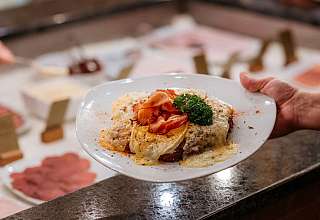 Plate with baked gratinated dish