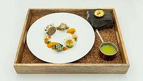 Gourmet dish on wooden tray