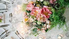 Flower arrangement on a festively laid table
