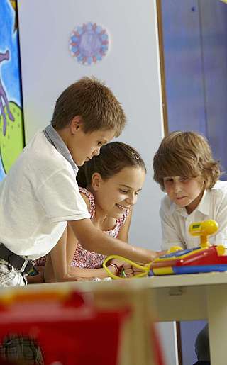 Children playing at the table