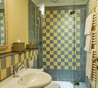 Colourfully tiled bathroom