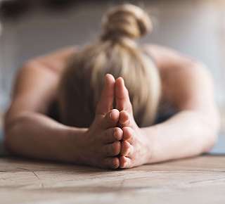 Woman in Forward Bend